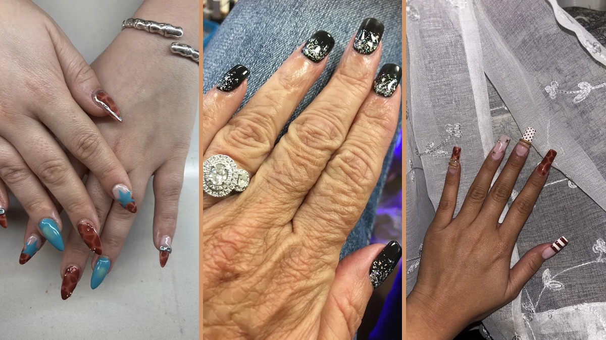 Hands receiving careful nail detail work.
